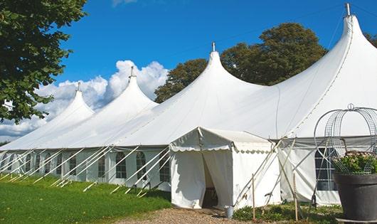 a row of portable restrooms placed outdoors for attendees of a special event in Norwalk, CT